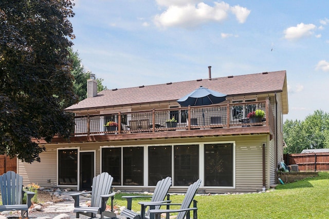 549 Vicki Ln, Shoreview, MN 55126 - rear view of house with a balcony and a chimney