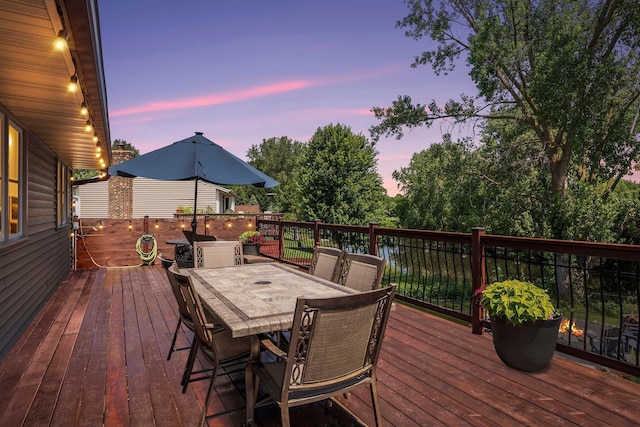 549 Vicki Ln, Shoreview, MN 55126 - deck at dusk featuring outdoor dining space