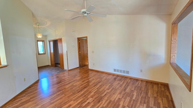 9136 Windsor Ter, Brooklyn Park, MN 55443 - spare room featuring wood finished floors, ceiling fan, and high vaulted ceiling