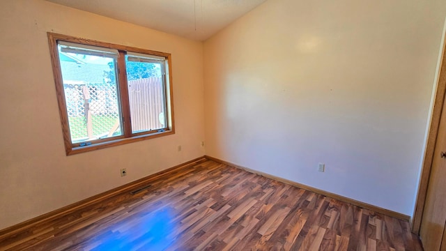 9136 Windsor Ter, Brooklyn Park, MN 55443 - unfurnished room featuring dark wood finished floors and baseboards