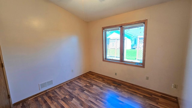 9136 Windsor Ter, Brooklyn Park, MN 55443 - unfurnished room featuring dark wood-style flooring