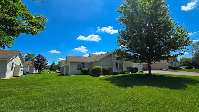 9136 Windsor Ter, Brooklyn Park, MN 55443 - view of front of house featuring a front yard and driveway