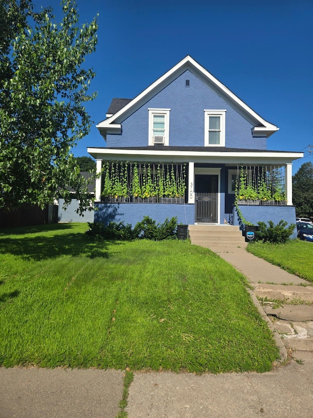 3100 23rd Ave S, Minneapolis, MN 55407 - traditional-style house featuring a front lawn