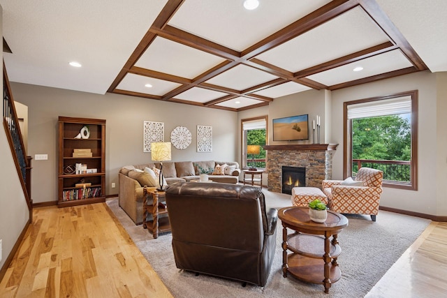 7461 Merrimac Ln N, Maple Grove, MN 55311 - living room with a stone fireplace, light wood-style flooring, coffered ceiling, recessed lighting, and beam ceiling
