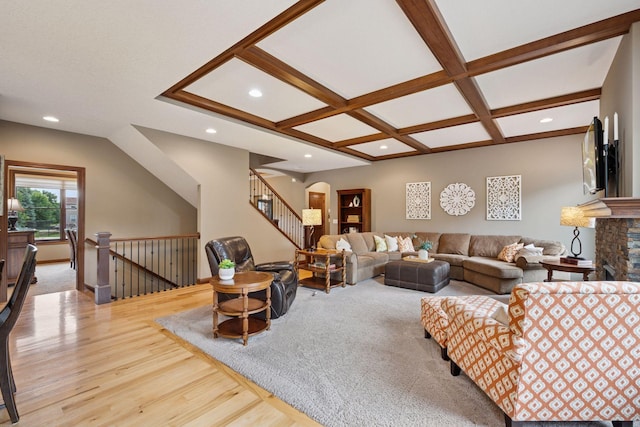 7461 Merrimac Ln N, Maple Grove, MN 55311 - living area featuring wood finished floors, recessed lighting, coffered ceiling, a stone fireplace, and stairs
