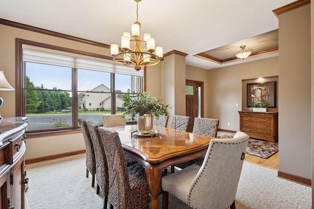 7461 Merrimac Ln N, Maple Grove, MN 55311 - dining area with a chandelier, ornamental molding, and a raised ceiling