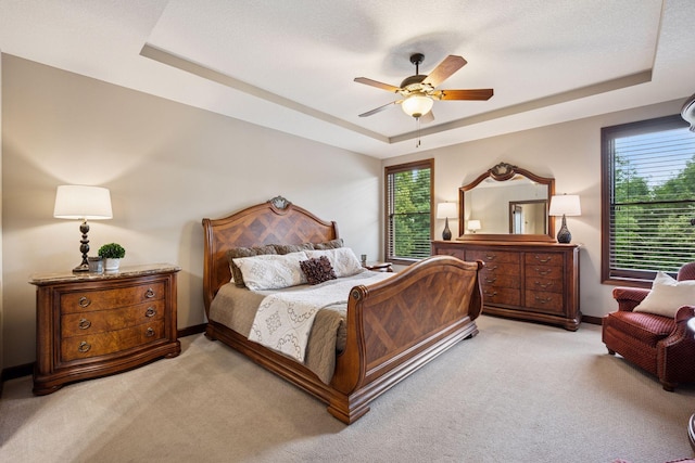 7461 Merrimac Ln N, Maple Grove, MN 55311 - bedroom featuring a raised ceiling, light colored carpet, and ceiling fan