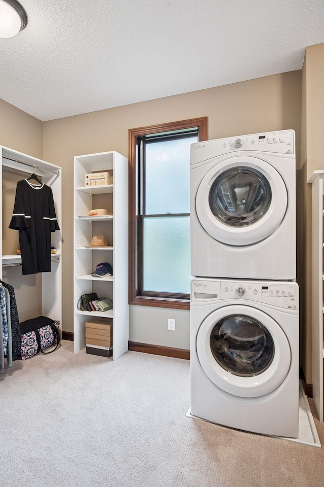 7461 Merrimac Ln N, Maple Grove, MN 55311 - washroom with stacked washer and clothes dryer, carpet, and a textured ceiling