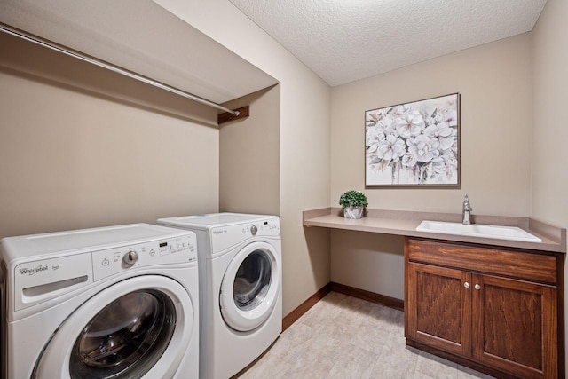 7461 Merrimac Ln N, Maple Grove, MN 55311 - washroom with washer and clothes dryer, a textured ceiling, and cabinet space