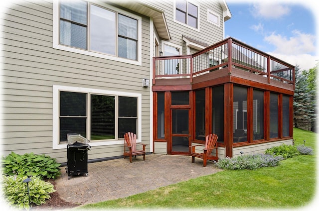 7461 Merrimac Ln N, Maple Grove, MN 55311 - rear view of house with a sunroom, a patio area, a wooden deck, and a lawn