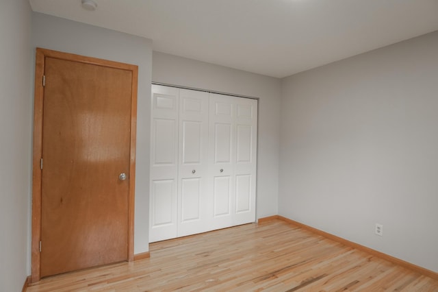 1781 Taconite Pt, Eagan, MN 55122 - unfurnished bedroom featuring light wood-style flooring and a closet