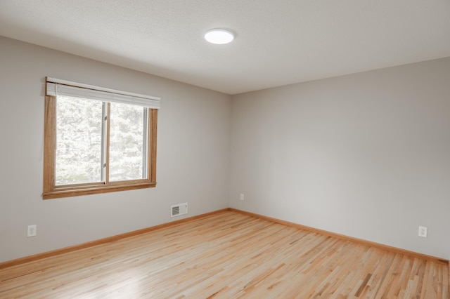 1781 Taconite Pt, Eagan, MN 55122 - spare room featuring wood finished floors and baseboards