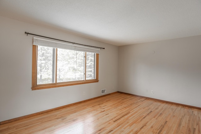 1781 Taconite Pt, Eagan, MN 55122 - empty room with wood finished floors and a textured ceiling