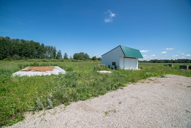 43724 County Highway 19, Blowers Twp, MN 56477 - view of yard featuring an outdoor structure and a view of countryside