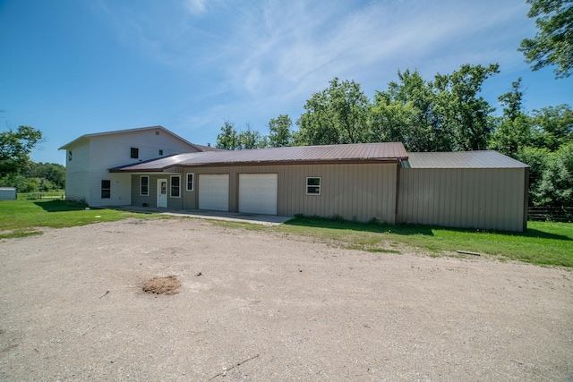43724 County Highway 19, Blowers Twp, MN 56477 - view of front facade featuring an attached garage, driveway, and a metal roof