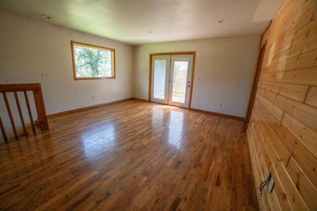 43724 County Highway 19, Blowers Twp, MN 56477 - empty room with wood finished floors and wooden walls