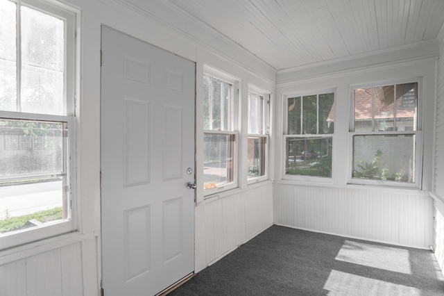 4020 Emerson Ave N, Minneapolis, MN 55412 - unfurnished sunroom with healthy amount of natural light, carpet floors, wood walls, crown molding, and wood ceiling