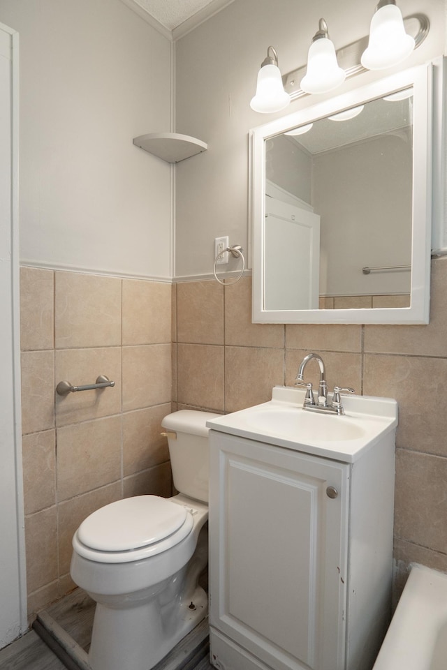 4020 Emerson Ave N, Minneapolis, MN 55412 - bathroom with tile walls and vanity
