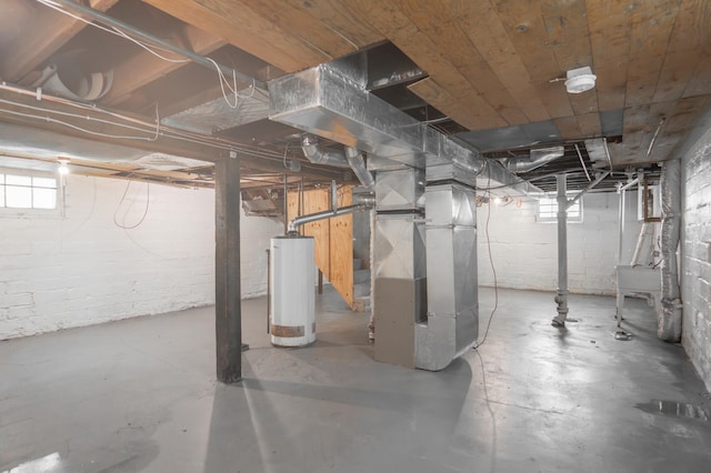 4020 Emerson Ave N, Minneapolis, MN 55412 - basement featuring water heater, heating unit, and healthy amount of natural light