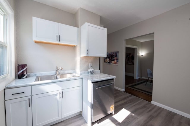 1702 Minnehaha Ave W, Saint Paul, MN 55104 - kitchen featuring dishwasher, light wood finished floors, white cabinets, and light stone countertops