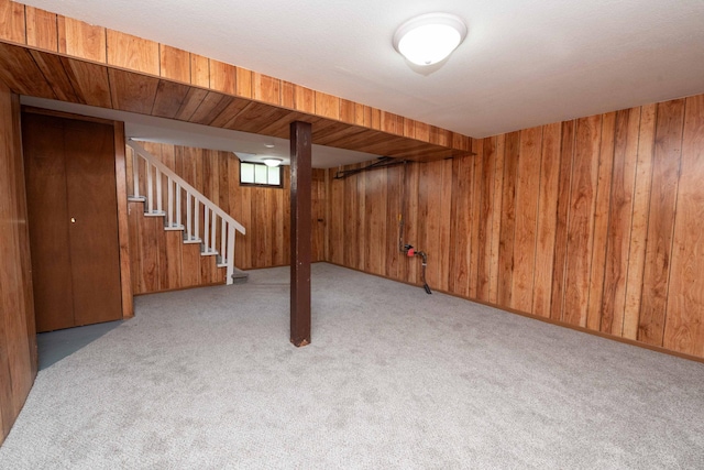1702 Minnehaha Ave W, Saint Paul, MN 55104 - basement featuring wooden walls, carpet flooring, and stairs