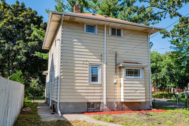 1702 Minnehaha Ave W, Saint Paul, MN 55104 - rear view of house featuring a chimney