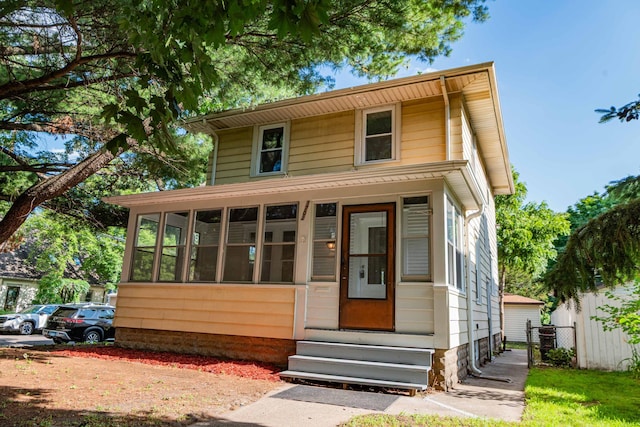 1702 Minnehaha Ave W, Saint Paul, MN 55104 - view of front of property with entry steps and a sunroom