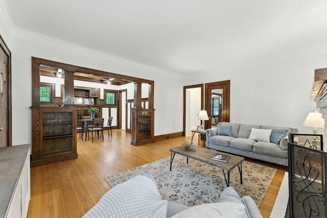 3148 Bryant Ave S, Minneapolis, MN 55408 - living room with light wood-style flooring and crown molding