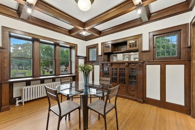 3148 Bryant Ave S, Minneapolis, MN 55408 - dining room with radiator heating unit, coffered ceiling, beamed ceiling, plenty of natural light, and light wood-style floors