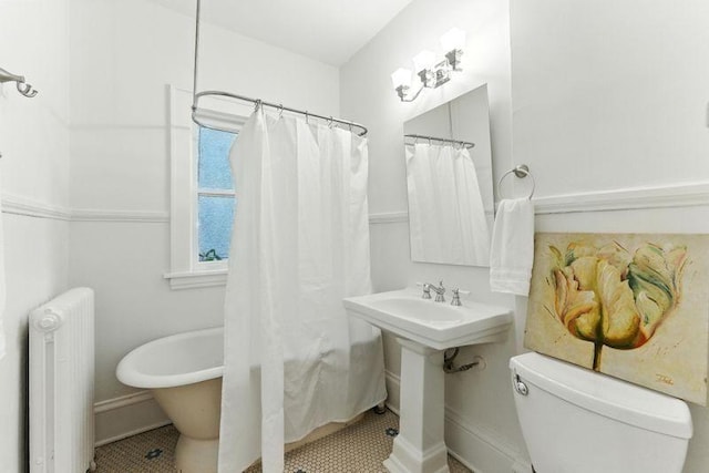 3148 Bryant Ave S, Minneapolis, MN 55408 - bathroom with radiator and tile patterned flooring