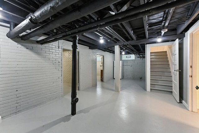 3148 Bryant Ave S, Minneapolis, MN 55408 - below grade area featuring stairs and brick wall