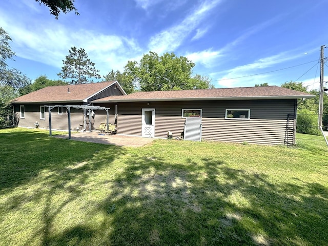600 Gilbert Ave S, Park Rapids, MN 56470 - back of house with a patio, a yard, and a shingled roof