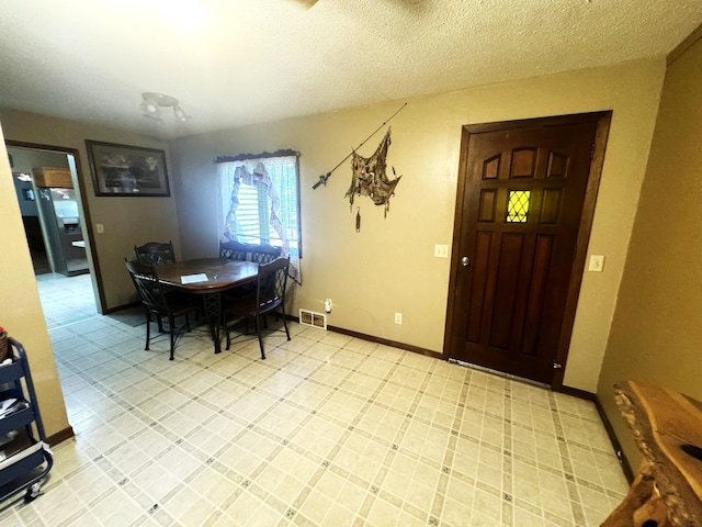 600 Gilbert Ave S, Park Rapids, MN 56470 - dining area with a textured ceiling