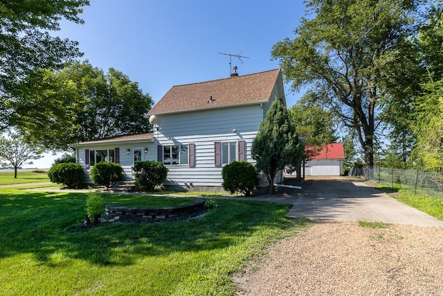 41072 280th St, Arlington Twp, MN 55307 - view of front of property with driveway, roof with shingles, an outbuilding, and a chimney