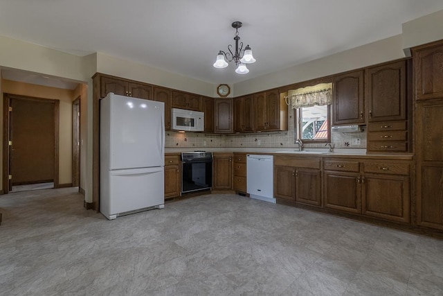 41072 280th St, Arlington Twp, MN 55307 - kitchen with white appliances, a chandelier, light countertops, light floors, and hanging light fixtures