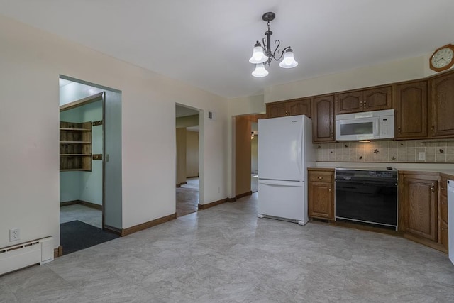41072 280th St, Arlington Twp, MN 55307 - kitchen with white appliances, a baseboard radiator, a chandelier, light countertops, and decorative light fixtures