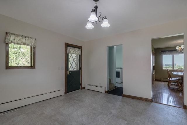 41072 280th St, Arlington Twp, MN 55307 - foyer with a chandelier, a baseboard heating unit, and a baseboard radiator