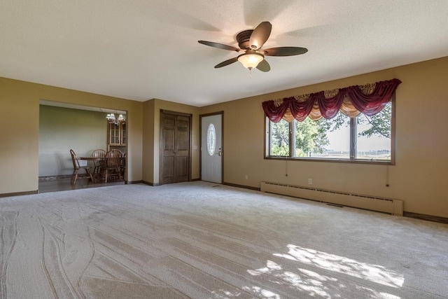 41072 280th St, Arlington Twp, MN 55307 - carpeted spare room featuring baseboard heating and a ceiling fan
