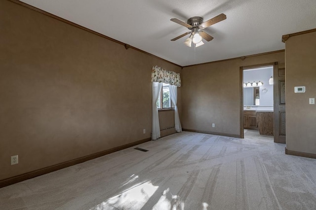 41072 280th St, Arlington Twp, MN 55307 - empty room with light carpet, a ceiling fan, and crown molding