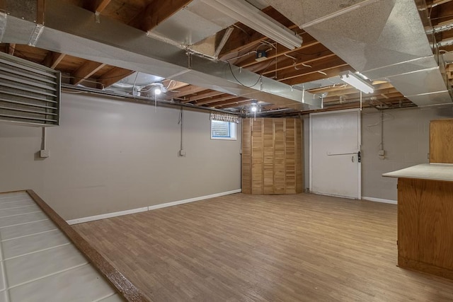 41072 280th St, Arlington Twp, MN 55307 - below grade area with wood finished floors and baseboards