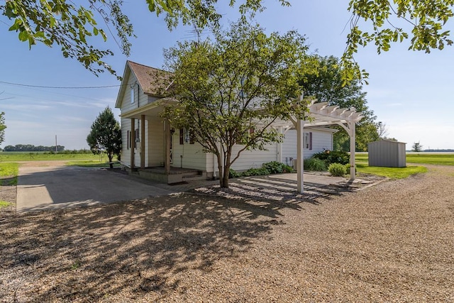 41072 280th St, Arlington Twp, MN 55307 - view of front of property with a storage shed and a pergola