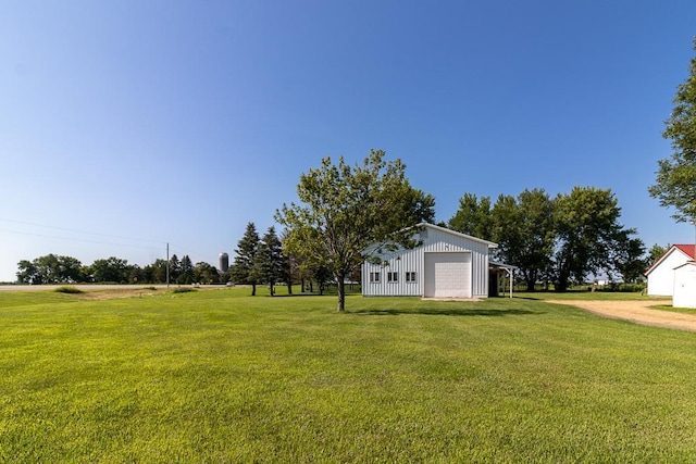 41072 280th St, Arlington Twp, MN 55307 - view of grassy yard with a detached garage, an outbuilding, and driveway
