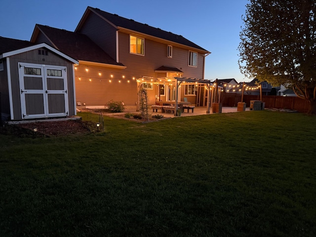 2907 Asarum Ct, Shakopee, MN 55379 - back of house with a storage unit and a patio