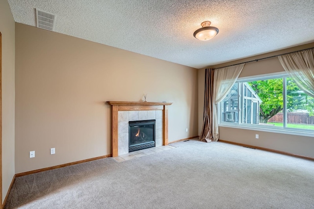 2907 Asarum Ct, Shakopee, MN 55379 - unfurnished living room with a textured ceiling, carpet floors, and a tile fireplace