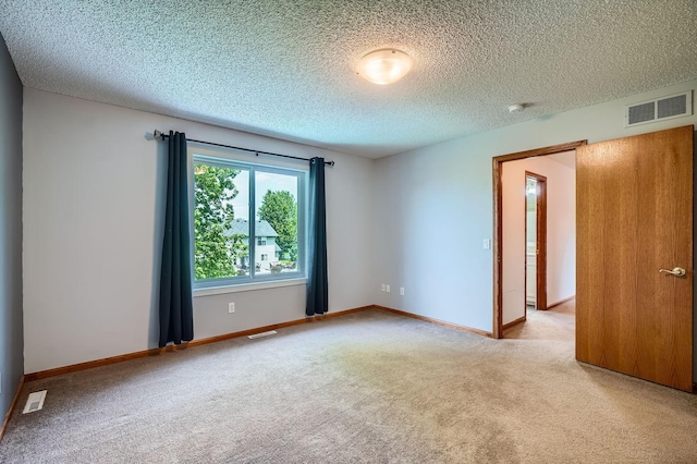 2907 Asarum Ct, Shakopee, MN 55379 - empty room with light carpet, a textured ceiling, and a smoke detector