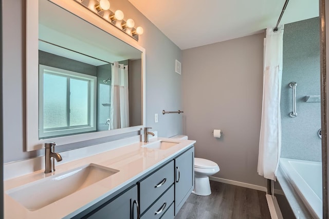 2907 Asarum Ct, Shakopee, MN 55379 - full bath featuring double vanity, wood finished floors, and shower / bath combination with curtain