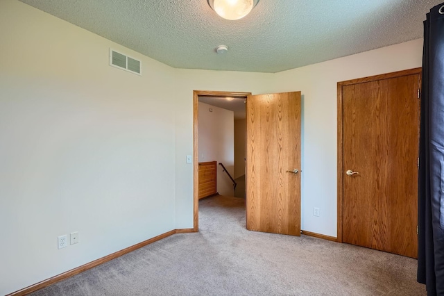 2907 Asarum Ct, Shakopee, MN 55379 - unfurnished bedroom with carpet flooring and a textured ceiling
