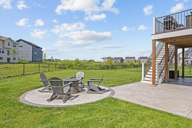 5027 Jansen Ave NE, Saint Michael, MN 55376 - fenced backyard featuring stairway, a patio area, an outdoor fire pit, and a residential view