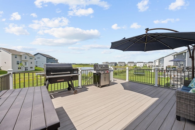 5027 Jansen Ave NE, Saint Michael, MN 55376 - wooden deck featuring a residential view, a lawn, and grilling area