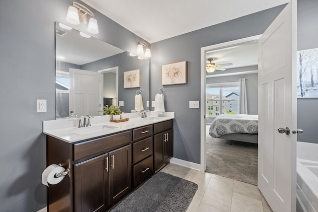 5027 Jansen Ave NE, Saint Michael, MN 55376 - ensuite bathroom featuring double vanity, tile patterned flooring, and a ceiling fan